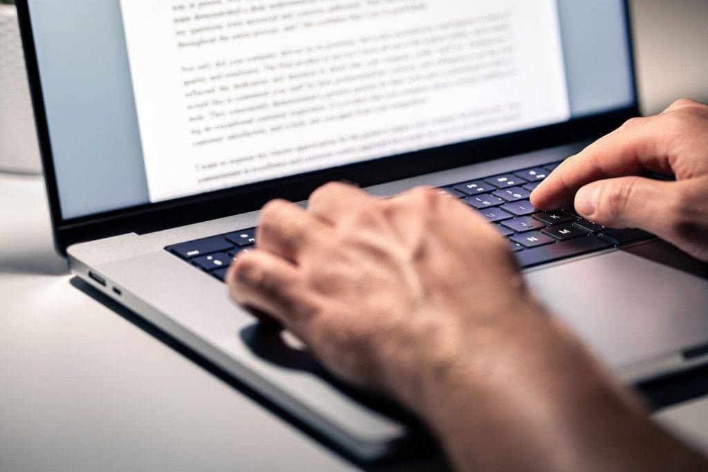 a deed poll application on a laptop