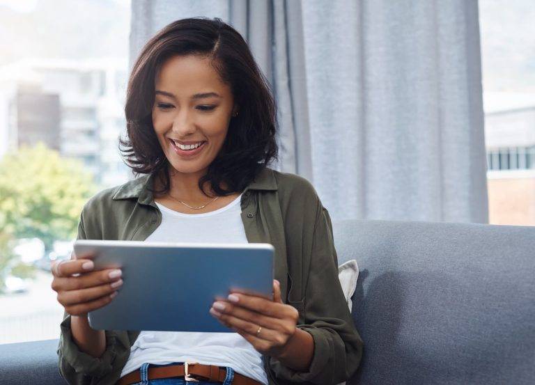 a woman completing a deed poll application